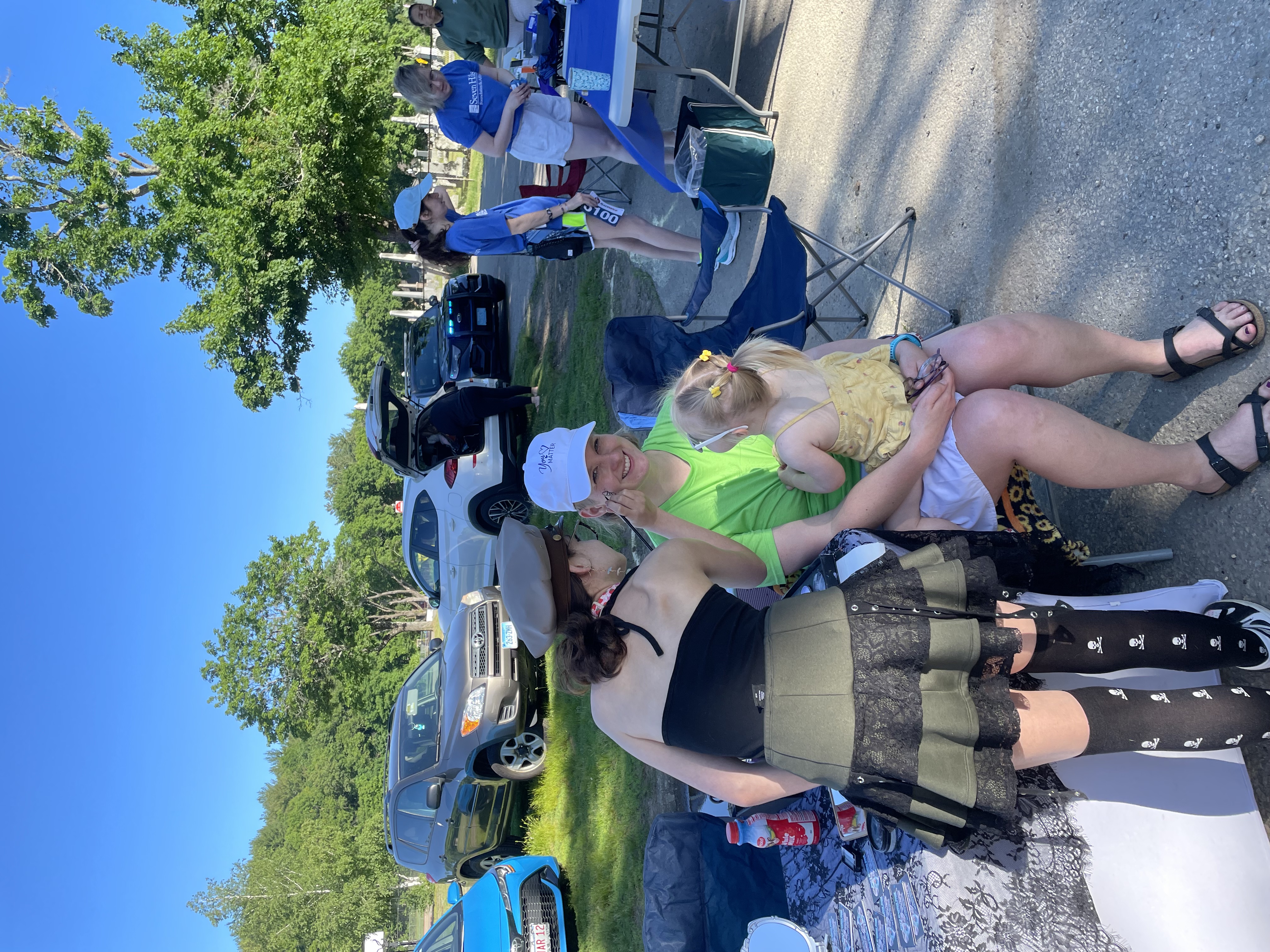 Volunteers laughing together at the 5K