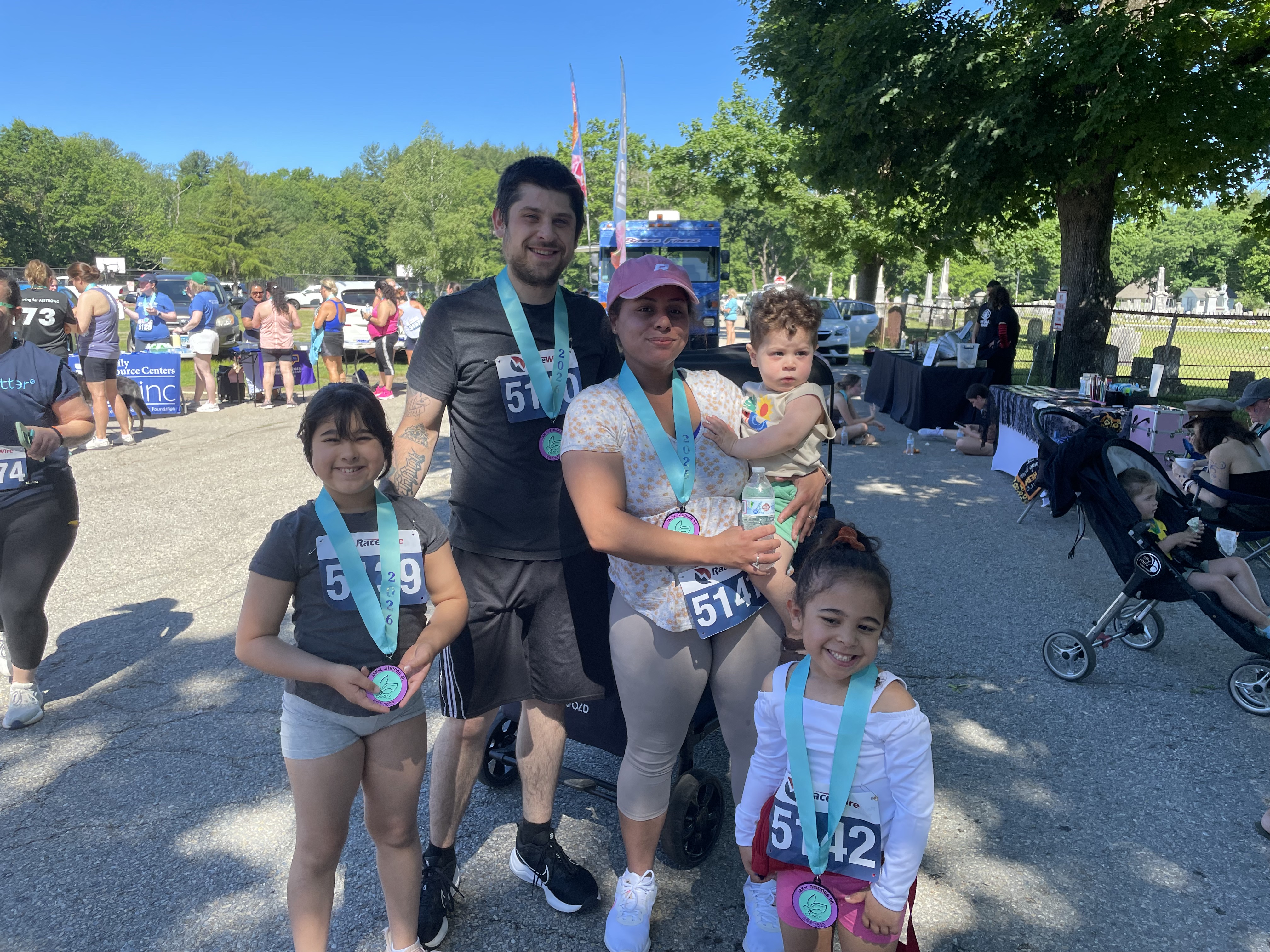 Family with medals celebrating at the race