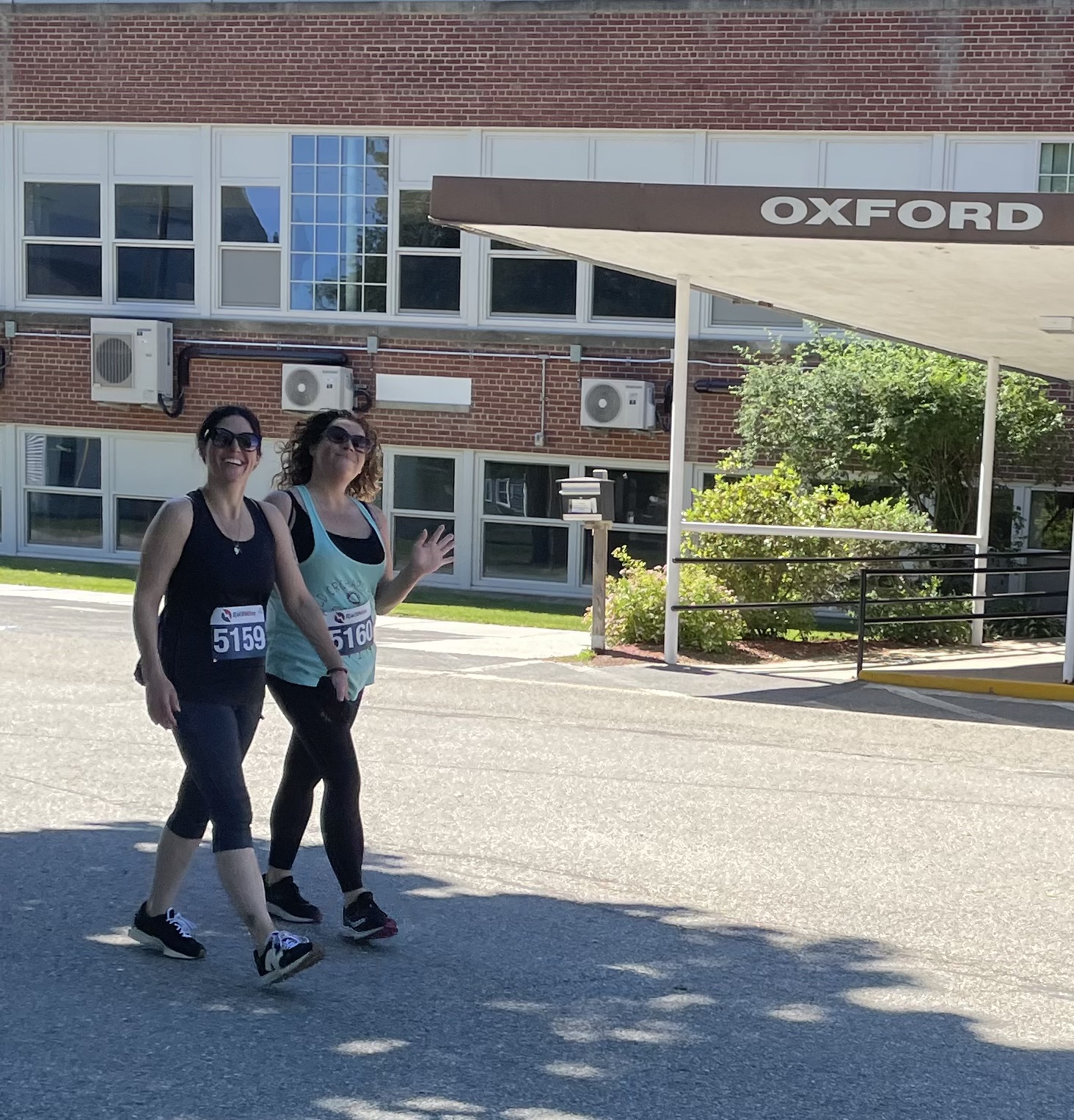 Two runners walking together at the 5K